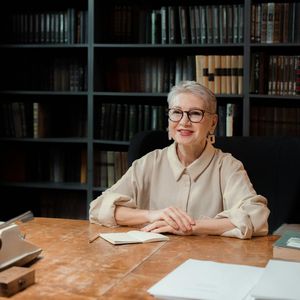 Expert Sofia Kravchuk smiling in a professional yoga setting.